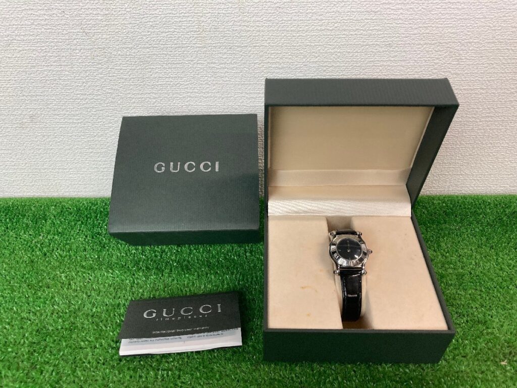 不動品　GUCCI　グッチ　腕時計　ローマンベゼル　6500L　QZ　クォーツ　黒文字盤　GGロゴ　レディース　箱有